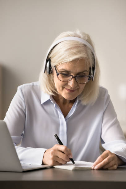 istock Focused happy elderly student woman watching training webinar 1781010053