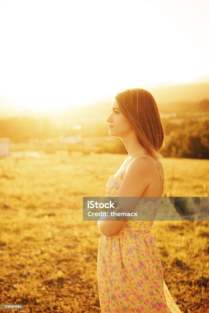 Waiting Portrait of waiting teenage girl with sunset. Adult Stock Photo