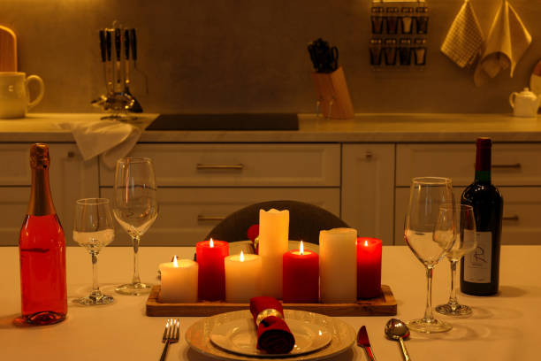 istock Romantic atmosphere. Beautiful table with candles, bottles and tableware served for Valentine day 1781015160