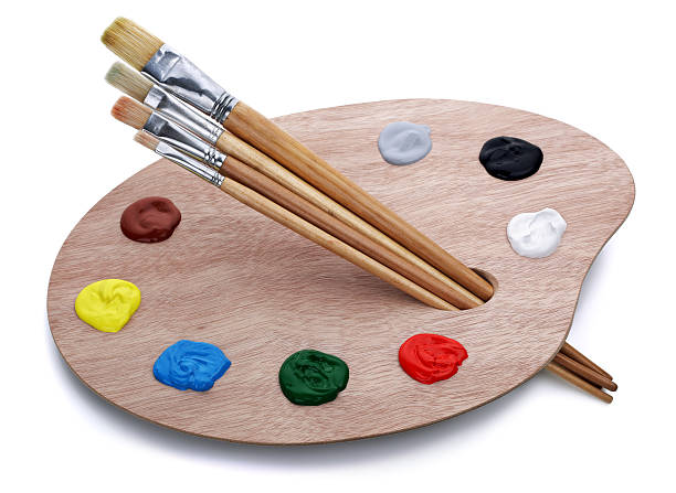 Artist's palette with brushes Artist's palette with brushes and oil paints isolated on white background oil paint palette stock pictures, royalty-free photos & images