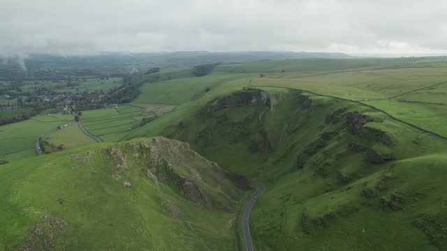 Winnats Pass on a cloudy Autumn day. Narrow road in a steep gorge, in Peak District, Derbyshire, England