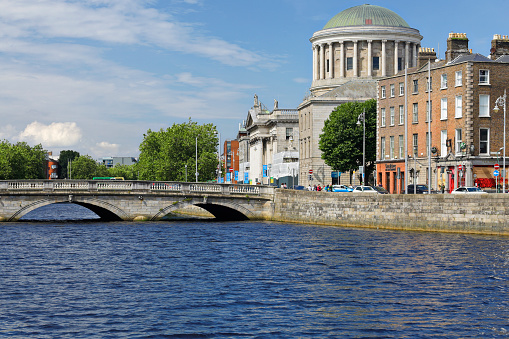 Daytime view of the O’Donovan Rossa bridge and the Four Courts (Dublin, Ireland).