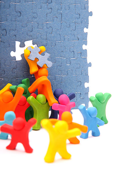 istock An illustration of a team solving a puzzle 178105098