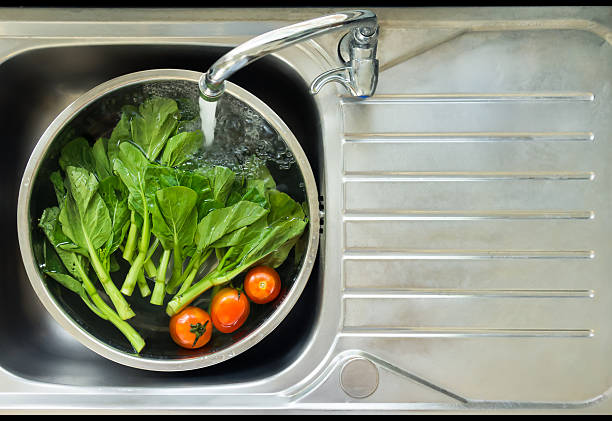 Vegetable washing stock photo