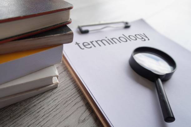 istock Books, magnifying glass and paper clipboard with text TERMINOLOGY. 1781056499