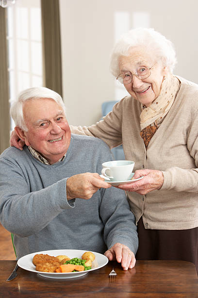 istock Senior Couple Enjoying Meal Together 178105742