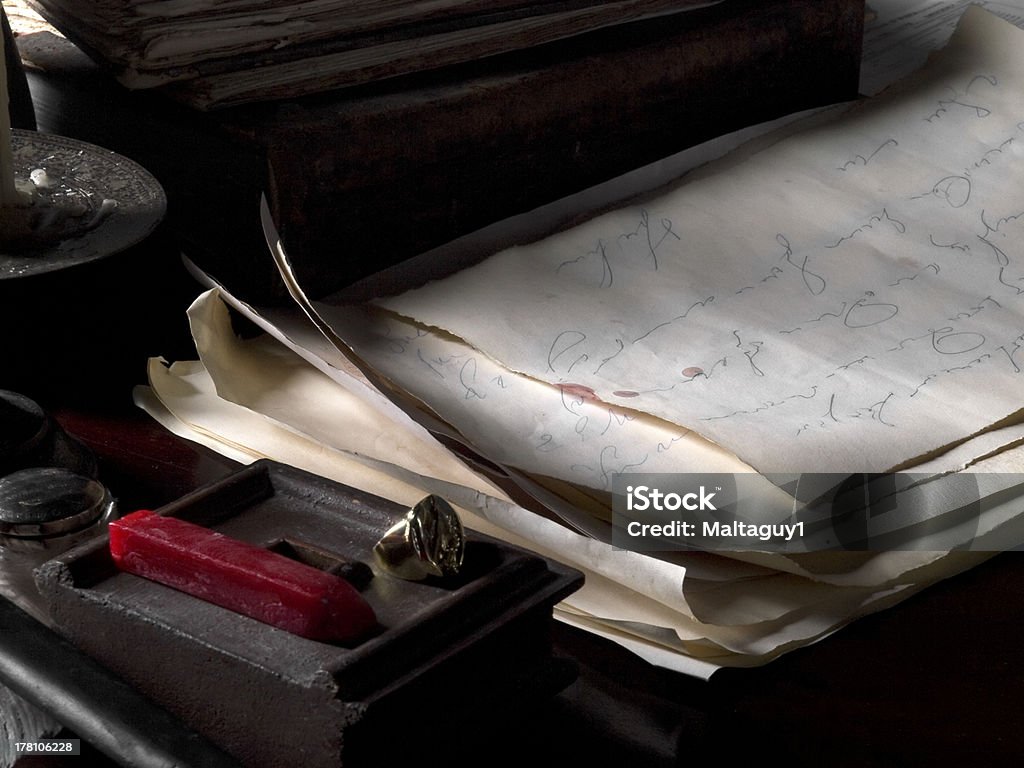 Medieval Study Detail of a medieval study showing antique documents or letter as well as signet ring and wax block Cygnet Stock Photo