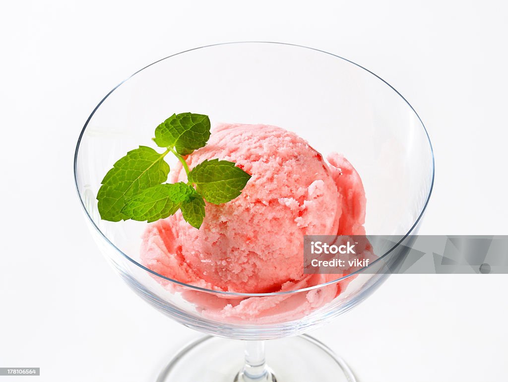 ice cream scoop of pink ice cream decorated with mint in a glass Arranging Stock Photo
