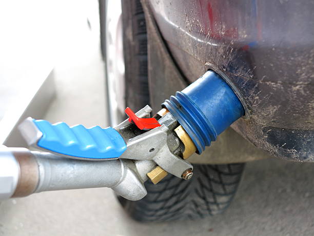 istock pumping gas in to the tank 178106583