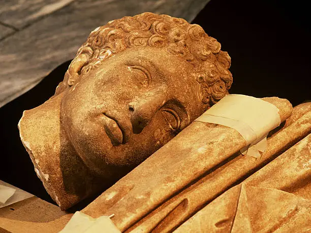 "head of hermes, life size, marble, found in the hellenistic town of messene (369 bc aa 395 ad). head is presented as found on the excavation."