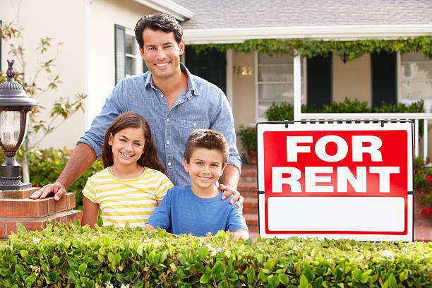istock Father and children outside home for rent 178107641