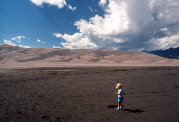 istock Great Sand Dunes NP - Small Boy & Giant Dunes - 1990 1781081587