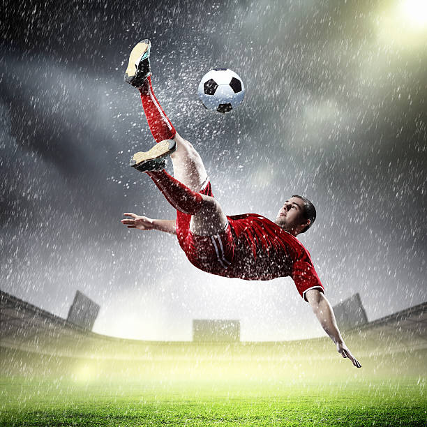 istock football player striking the ball 178108283