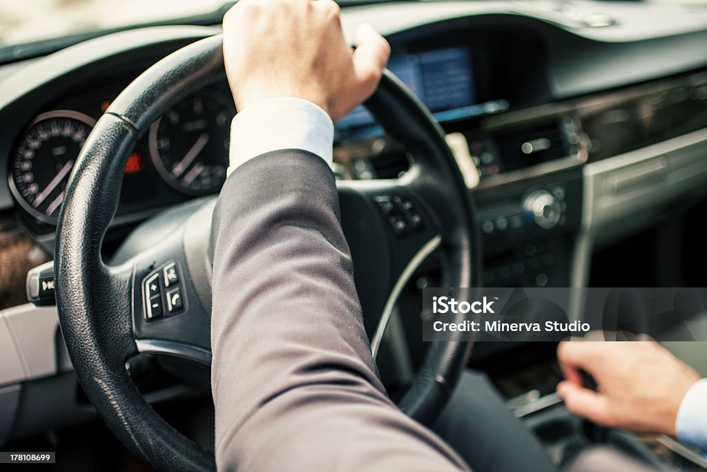Car driver Detail of a man driving his car Adult Stock Photo