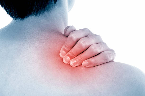 Acute pain in a neck at the young sportsman stock photo