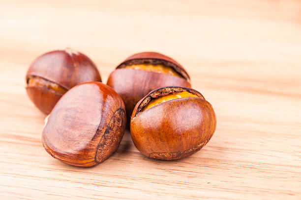 azúcar castaña asada - chestnut sweet food yellow group of objects fotografías e imágenes de stock