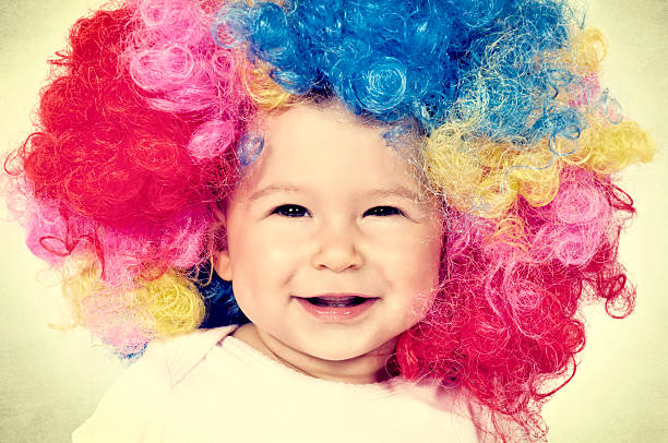 Baby with clown wig in vintage technique