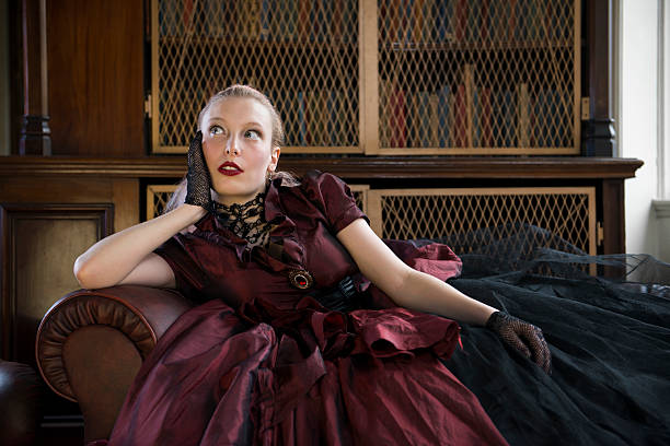istock Victorian woman in library 178112579