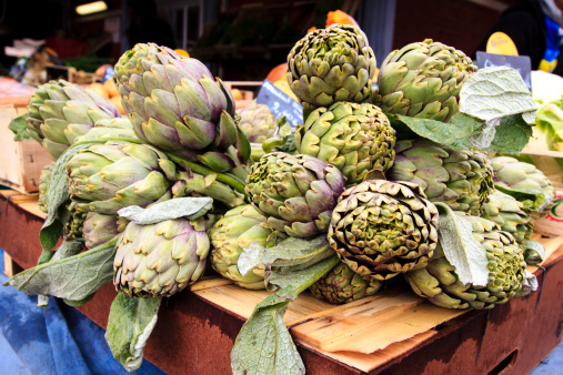 Artichokes available for sale in open market stand, Toulouse, France