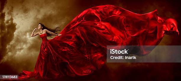 Woman Red Dress Fashion Model Waving Flying Fabric Gown Cloth Stock Photo - Download Image Now