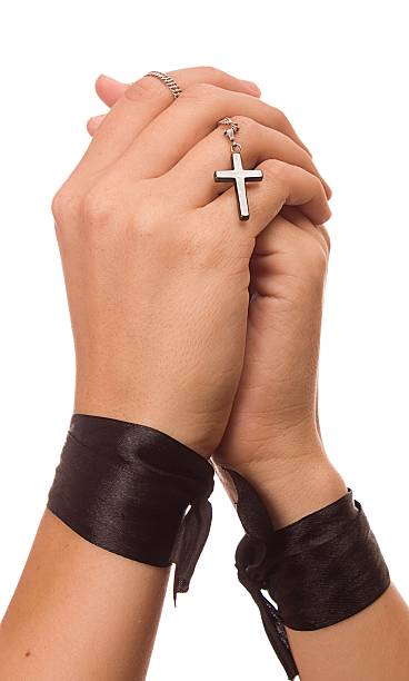istock Woman is praying holding her cross. On white background. 178114589