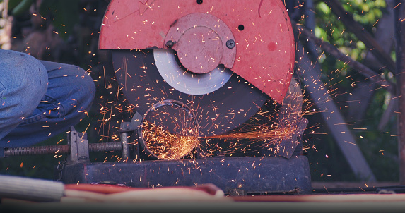 Welding machinery iron metal sparking equipment. Hot flame welding metal work cutting fire iron workshop. Locksmith using Welding machine cutting metal process grinder. Heavy Engineer metalworking
