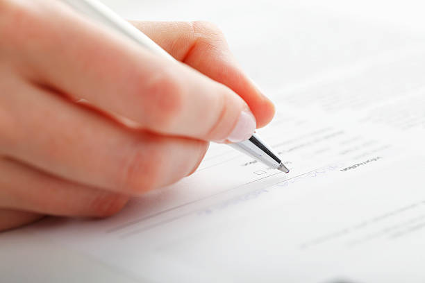 istock Businesswoman writing on a form 178116881