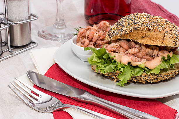 istock Roll with Shrimps on a red striped tablecloth 178117299