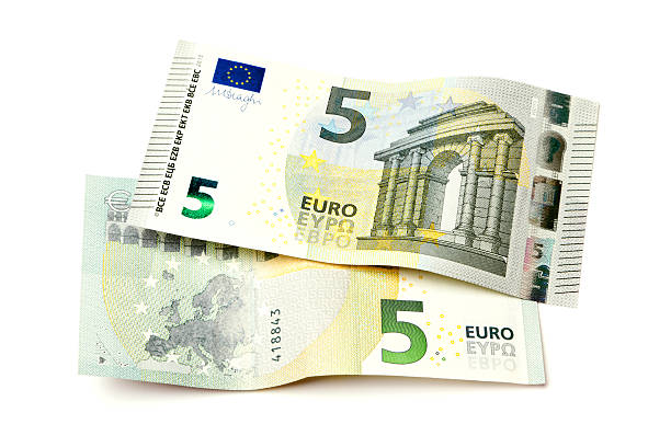 due nuove cinque euro banconote isolati - five euro banknote new paper currency currency foto e immagini stock