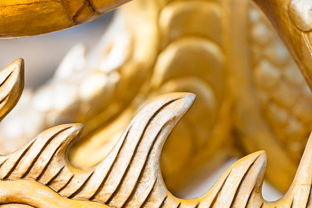 istock Golden sculpture close-up showing dragon spine. 178117529