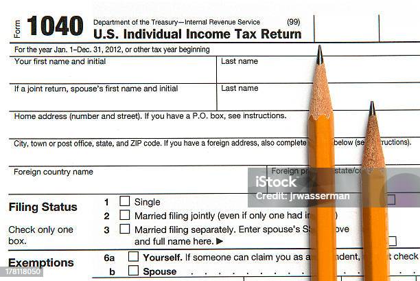 Taxes And Pencils Stock Photo - Download Image Now - Accounting Ledger, Analyzing, Balance