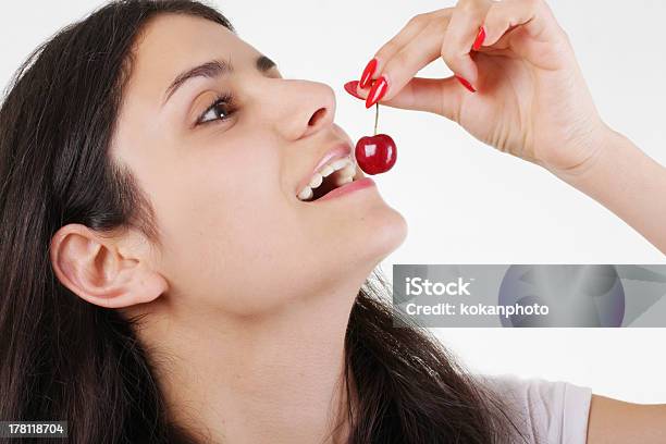 Girl Eating Cherries Stock Photo - Download Image Now - Adult, Adults Only, Beautiful People