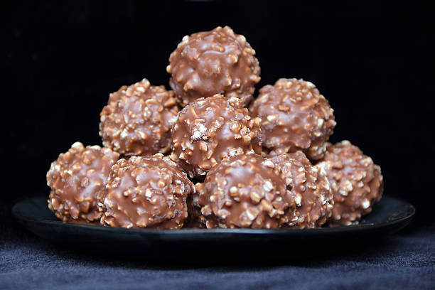 istock Brown sweet candy on black background 178118818