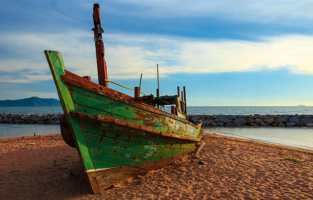 istock Traditional thai boats at sunset beach. 178118925
