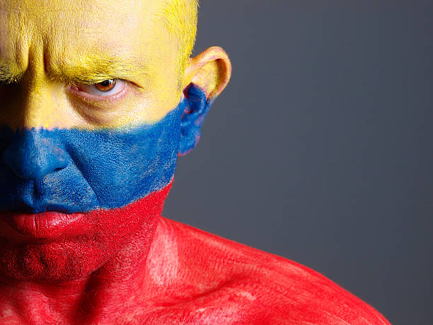 istock Man and his face painted with Colombian flag. 178119053