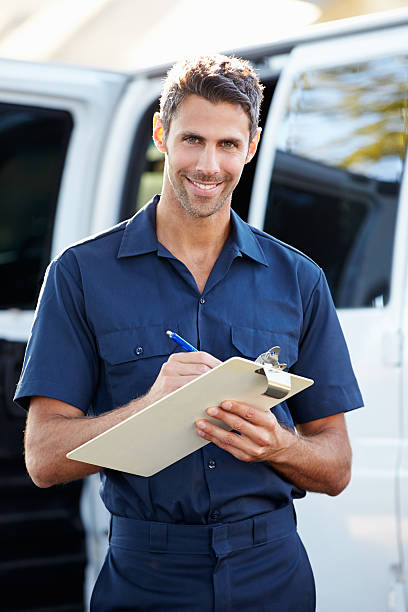 istock Portrait Of Delivery Driver With Clipboard 178119126