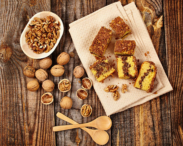 Cookies with walnut and cocoa filling on a wooden board