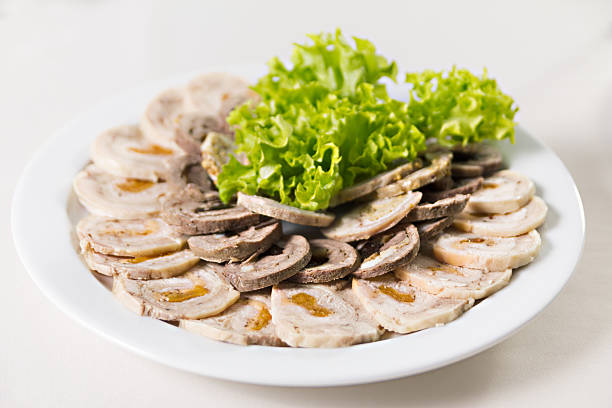 beef roll with dried apricots and salad closeup stock photo