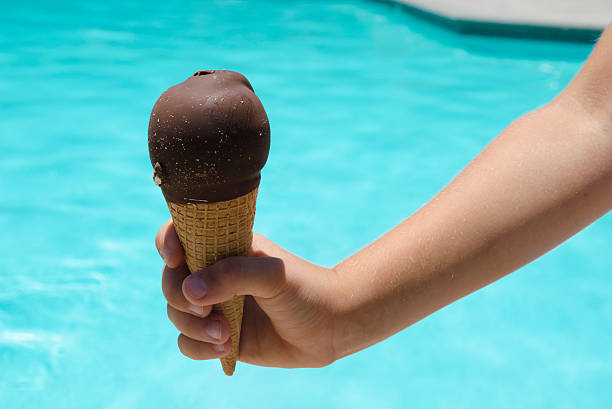 istock Ice cream in a child's hand close-up 178121009