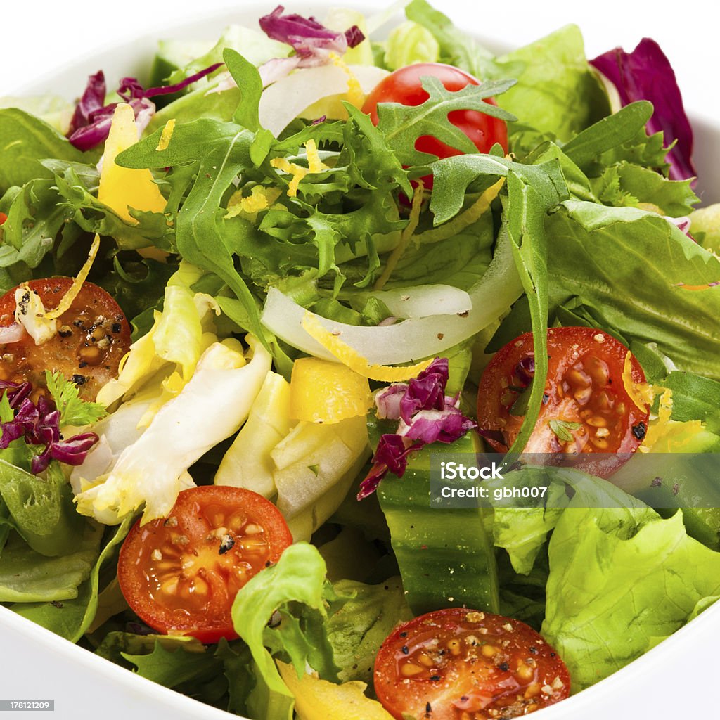Healthy eating - vegetable salad Vegetable salad -lettuce, tomatoes, cucumbers Antipasto Stock Photo