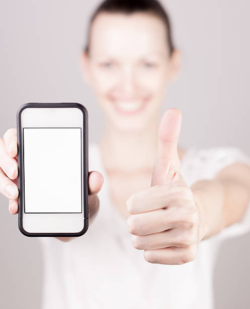 istock Woman showing a blank smart phone 178121233