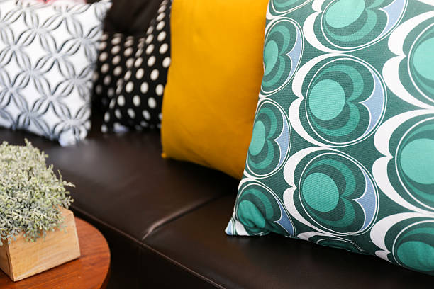 istock Close-up of colorful pillows on a leather sofa 178123301
