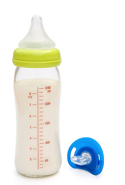 istock baby bottle and blue pacifier with clipping path 178123447