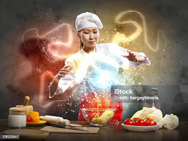 Asian Female Cooking With Magic Stock Photo - Download Image Now - Above, Adult, Apron