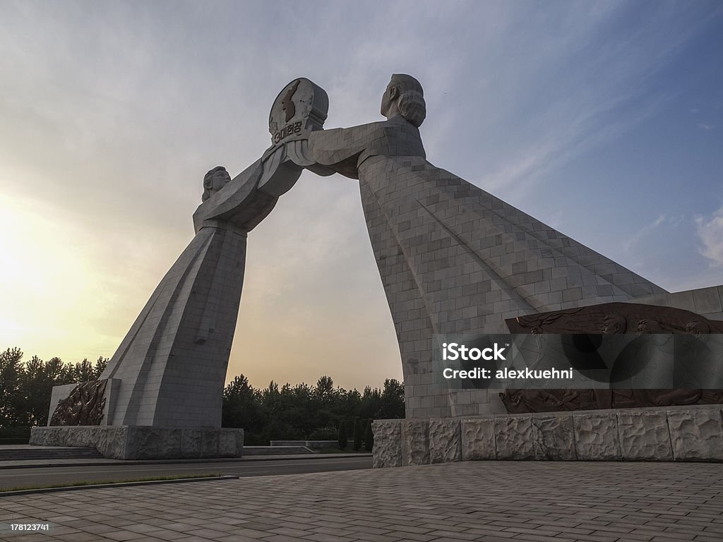 Arch of Reunification at sunset in Pyongyang, North Korea The Arch of Reunification is a sculptural monumental arch located in near Pyongyang, the capital city of North Korea. It was constructed in 2001 to commemorate Korean reunification. The concrete arch straddles the multi-laned Reunification Highway leading from Pyongyang to the Korean Demilitarized Zone (DMZ). Aggression Stock Photo