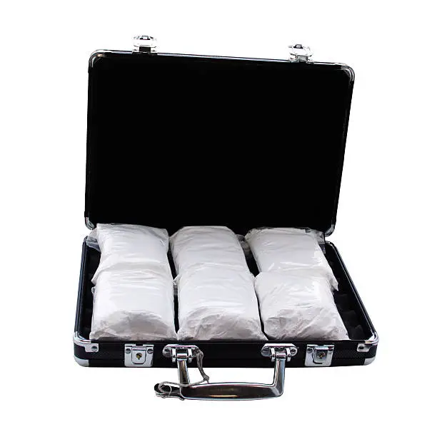 Cocaine in a suitcase (really it's powdered sugar).