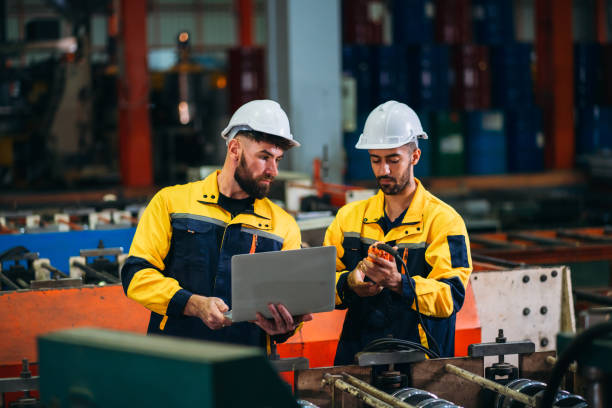 istock Engineers or foreman inspecting and check up machine at factory machines. Worker industry working in the metal sheet company. 1781242954