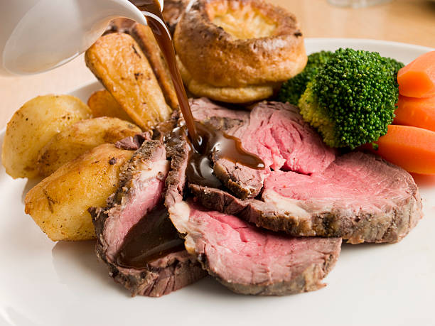istock Gravy being Poured on a plate of Roast Beef 178124383