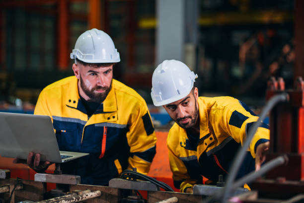 istock Engineers or foreman inspecting and check up machine at factory machines. Worker industry working in the metal sheet company. 1781244005