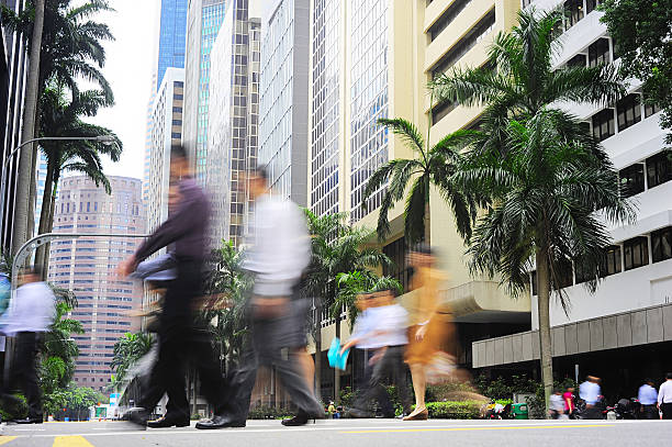 istock Motion-blurred people walking on a street in Singapore 178124736